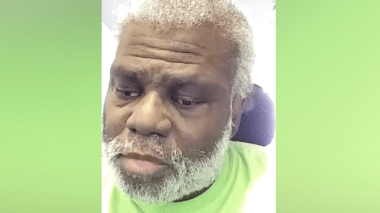 Bernard, a black man with a white beard, fills the frame and wears a green shirt